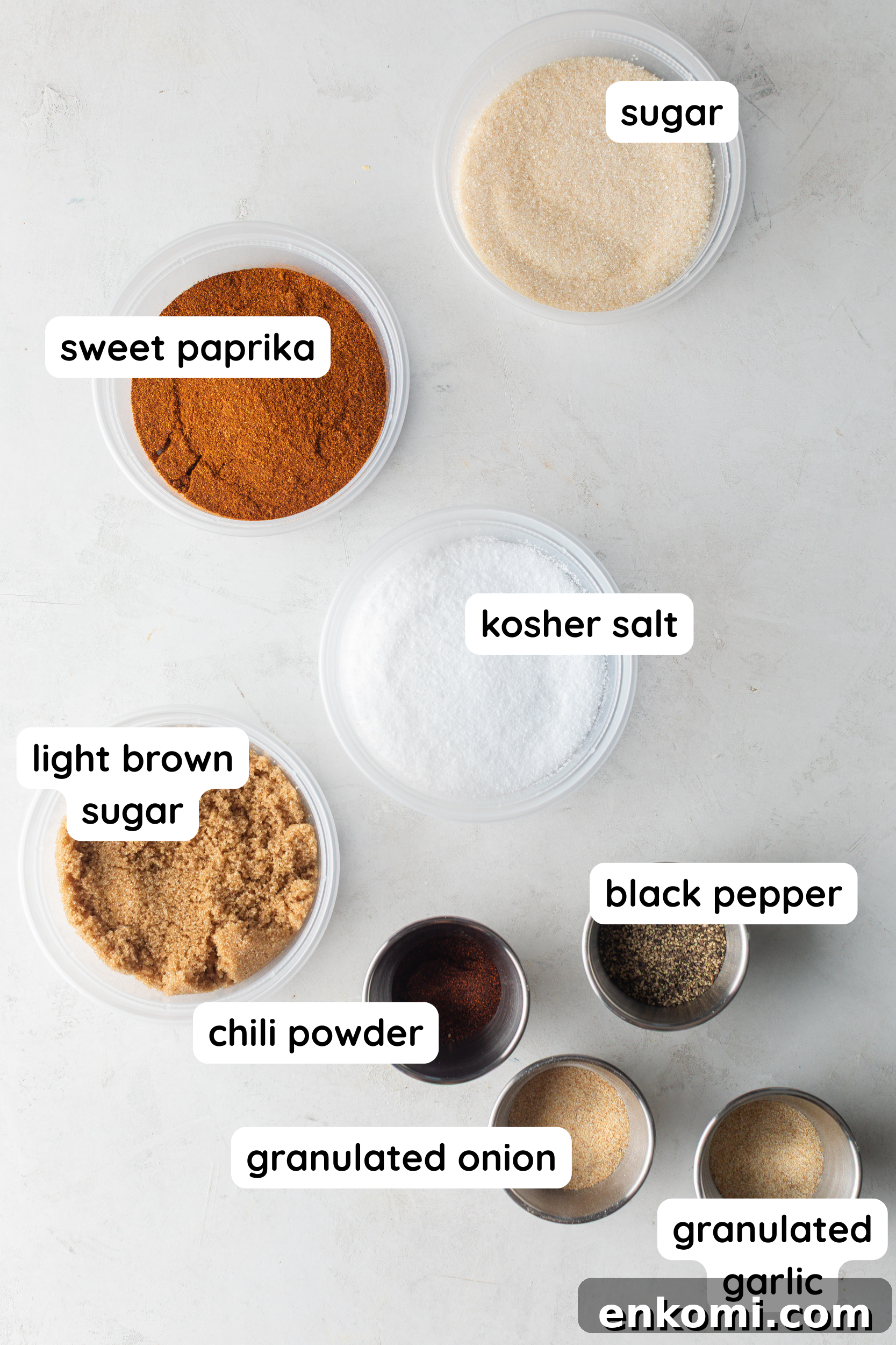 Homemade BBQ Rub Recipe for Tender, Flavorful Grilling 3 Homemade BBQ seasoning ingredients: paprika, sugar, salt, light brown sugar, black pepper, chili powder, granulated onion, granulated garlic.