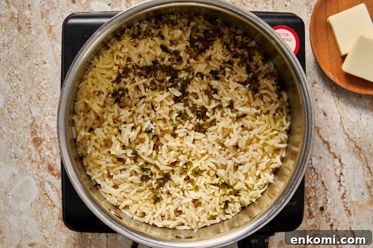 Garlic Butter Rice Recipe: Fluffy, Flavorful Side Dish 7 rice being cooked in a pot