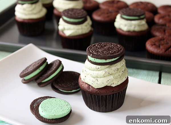 Mint Cookies and Cream Cupcakes Recipe for Refreshing Dessert 4 Mint Cookies 'N Cream Cupcakes with cookies in the cake and in the frosting | by Lauren Kapeluck for TheCakeBlog.com
