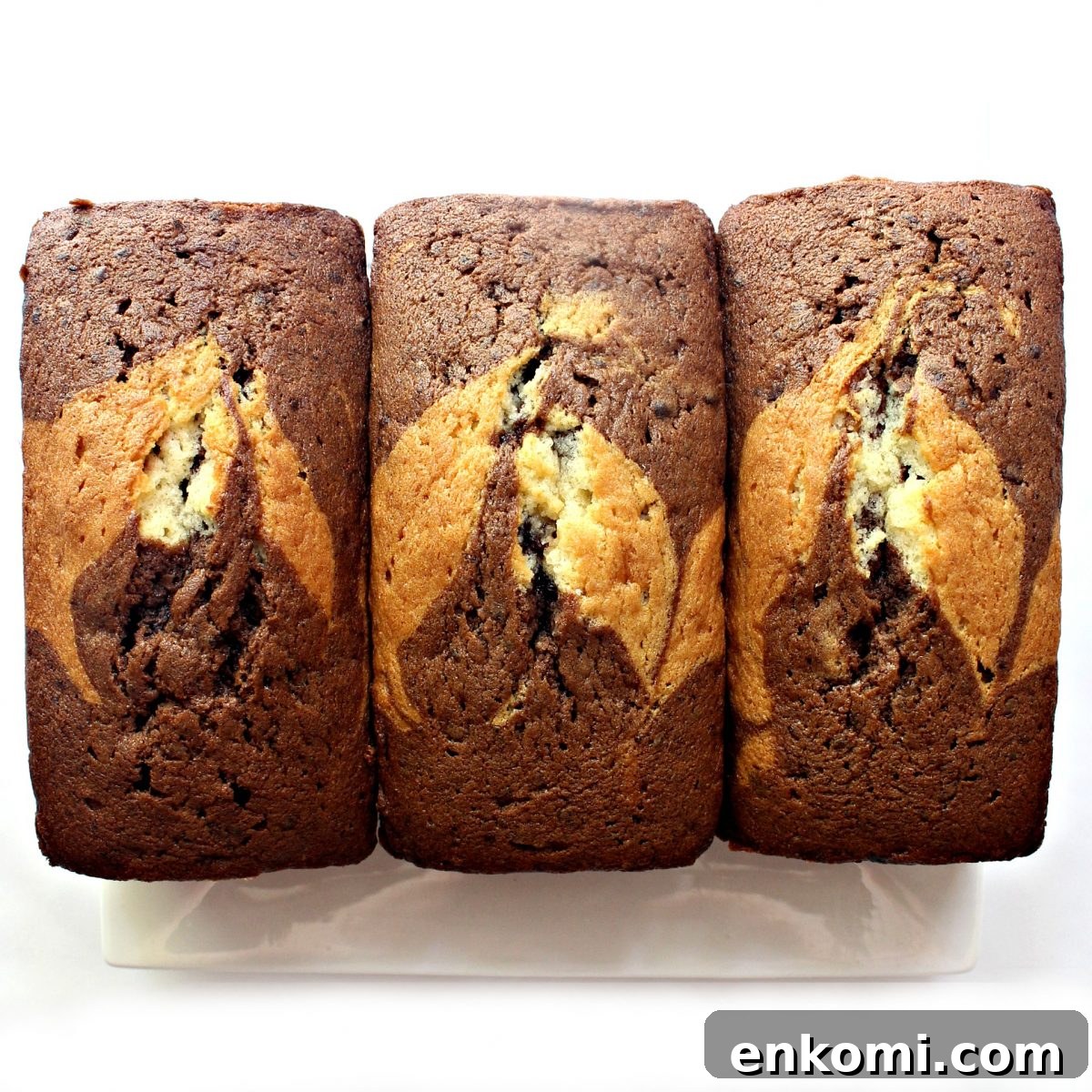 Three loaves of marbled chocolate and vanilla pound cake.