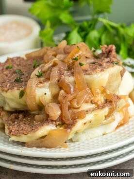 French Onion Meatloaf with Caramelized Onions and Gruyère 8 Sliced slow cooker french onion meatloaf on a plate.