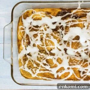 Vintage Coffee Cake Recipe for Bread Machines: Perfect Morning Bake 2 The final coffee cake in a glass baking dish, drizzled with white glaze.
