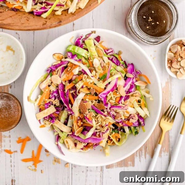 Creamy Dill Potato Salad with Fresh Herbs & Lemon Zest 11 Overhead view of asian style salad in a white bowl.