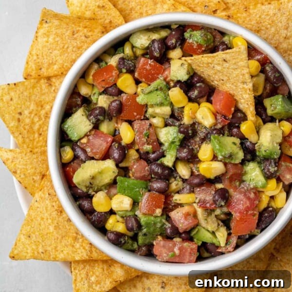 Creamy Dill Potato Salad with Fresh Herbs & Lemon Zest 12 Overhead view of black bean, avocado, and corn salad with tortilla chips.