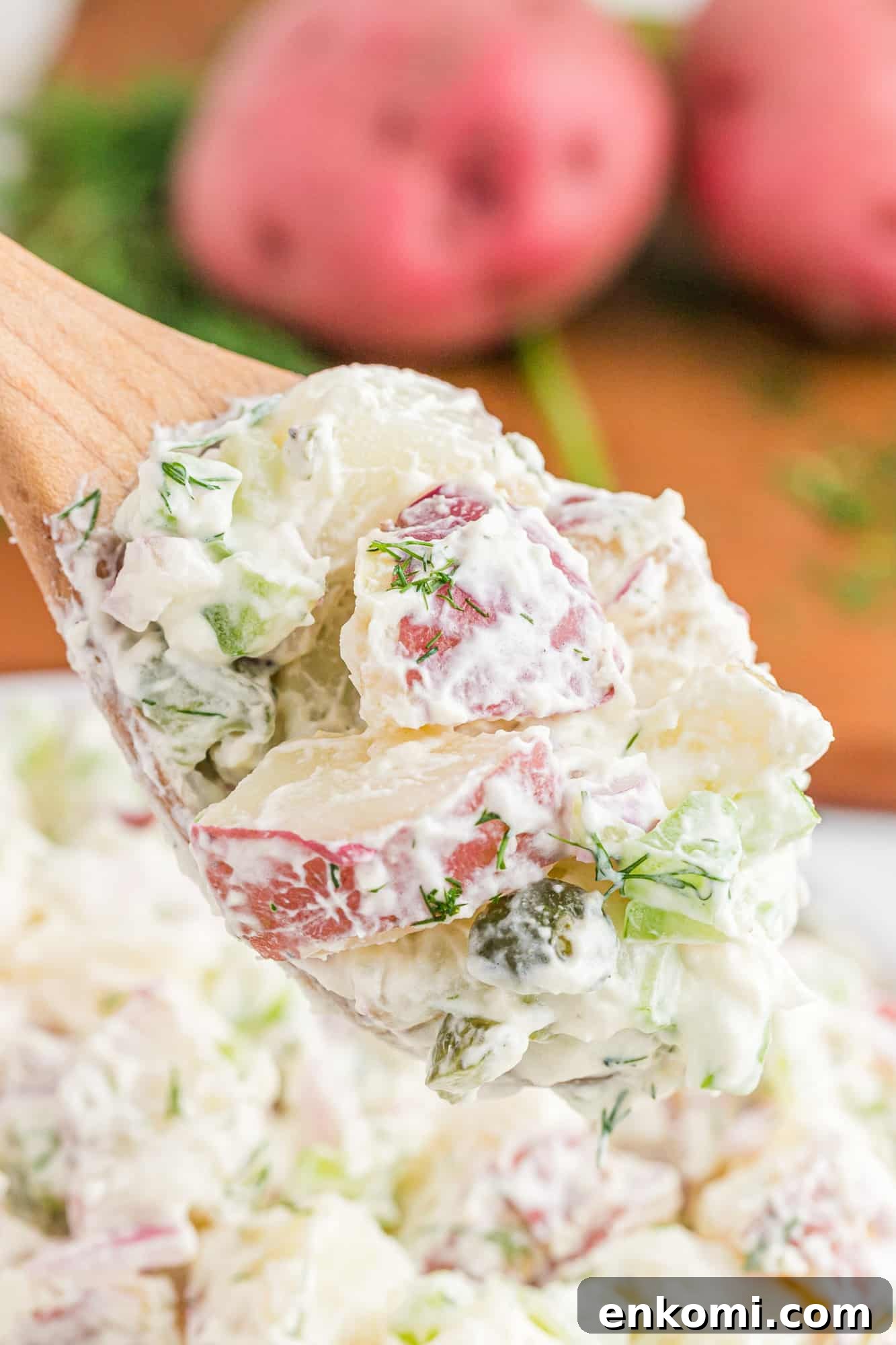 Creamy Dill Potato Salad with Fresh Herbs & Lemon Zest 3 Potato salad on a spoon.