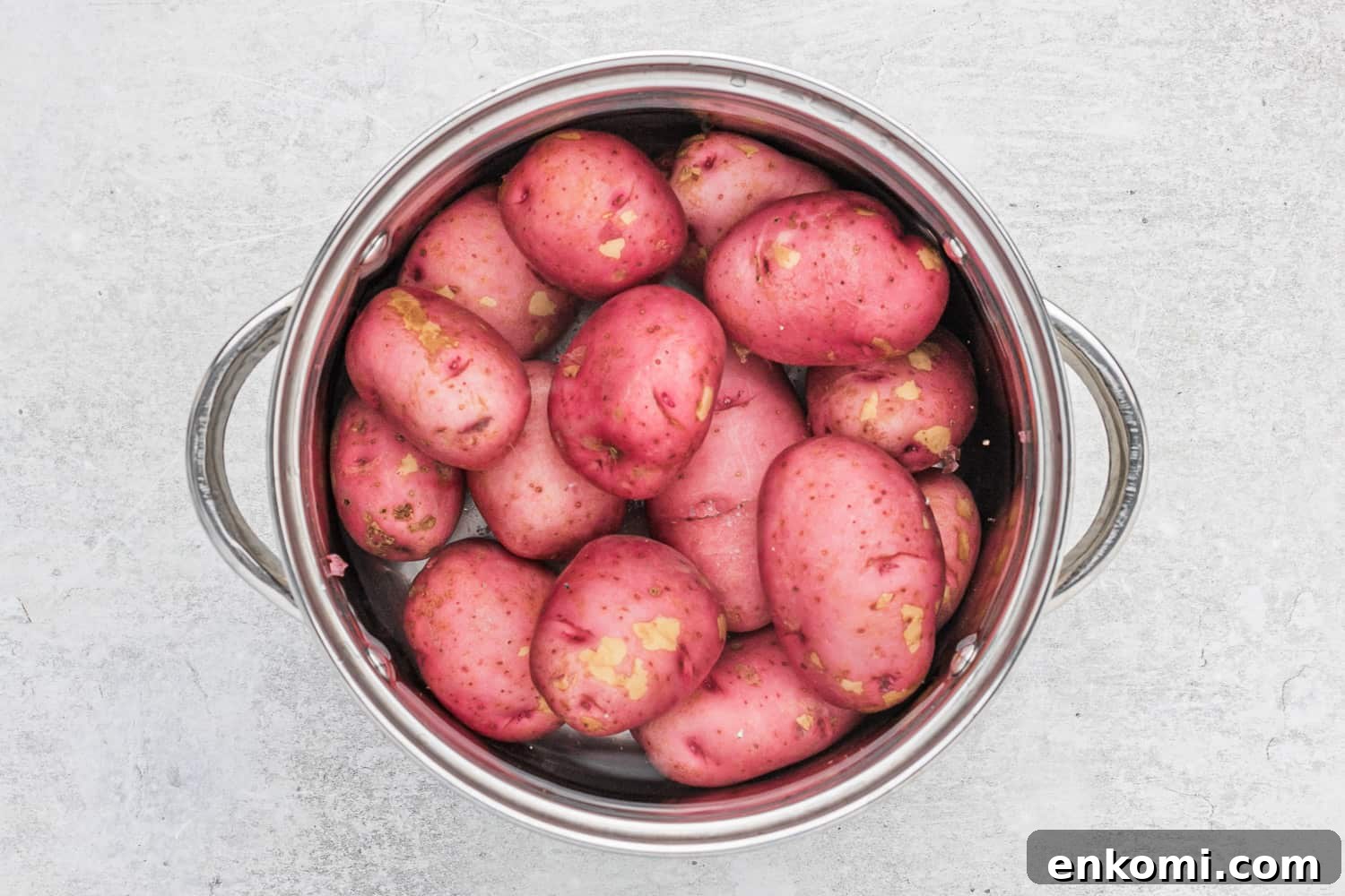 Creamy Dill Potato Salad with Fresh Herbs & Lemon Zest 5 Potatoes in a collander.