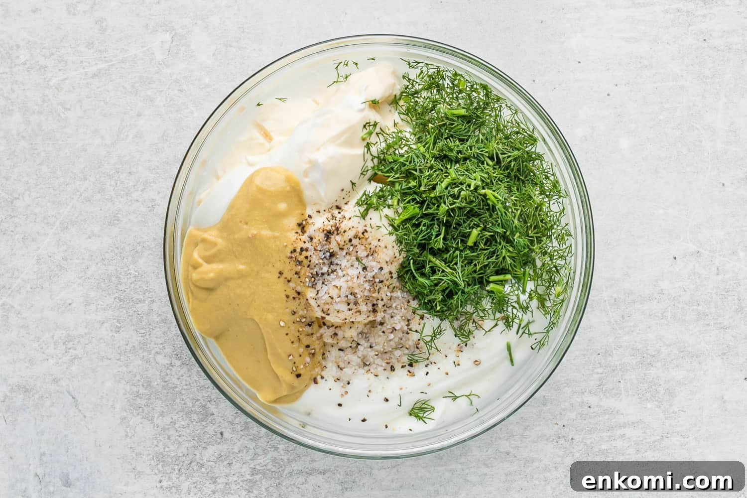 Creamy Dill Potato Salad with Fresh Herbs & Lemon Zest 6 Dressing ingredients in a glass mixing bowl.