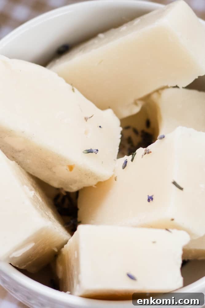 Soothing Homemade Baby Soap Bar Recipe 4 White bowl full of lavender soap bars.