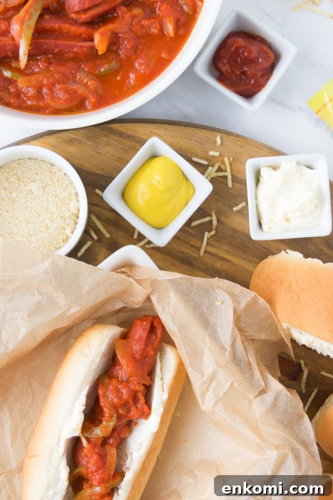 Brazilian Hot Dogs spread with sauce and toppings
