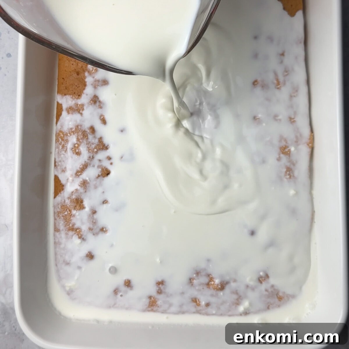 Authentic Tres Leches Vanilla Milk Cake Recipe 6 Transfer to a baking dish & bake, once cooled add the milk!