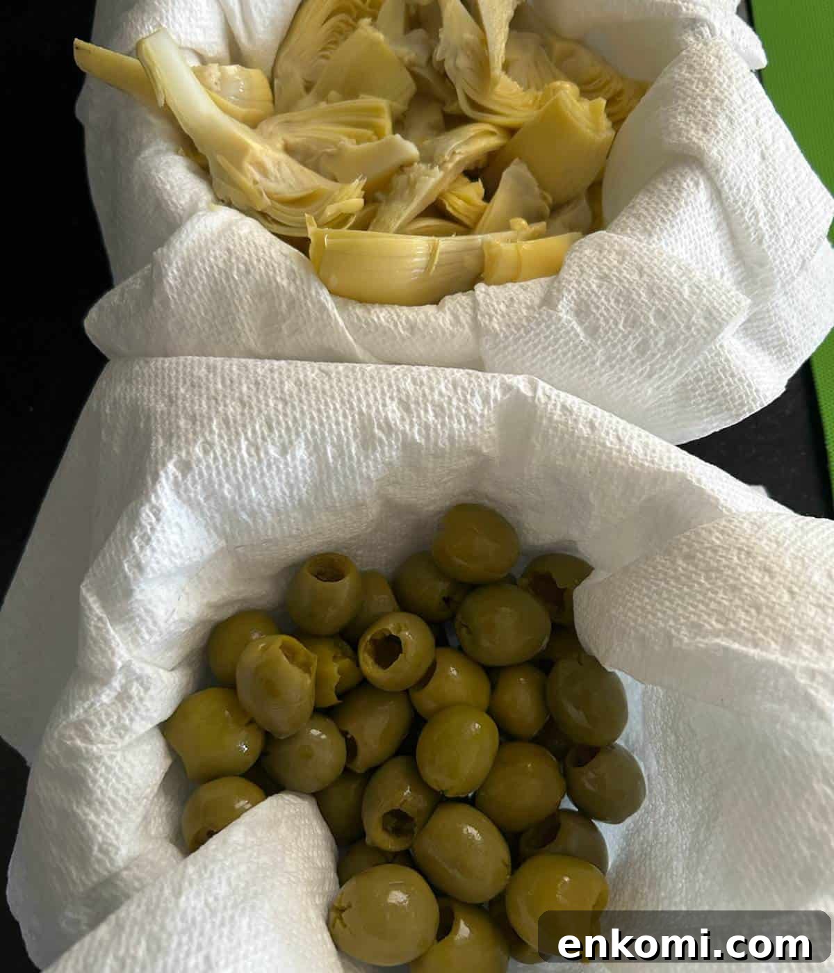 Charcuterie Skewers: Delicious Crowd‑Pleaser Appetizer Recipe 5 Olives and artichokes in bowls with paper towels to remove excess juices.