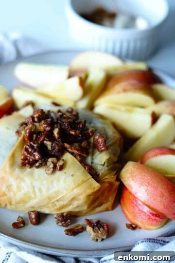 baked brie on plate with side of honey crisp apples