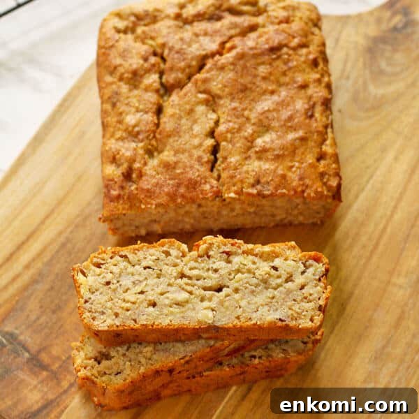 Low-Sugar Banana Bread Recipe for Moist, Flavorful Loaves 6 slices of healthy banana bread stacked on top of each other with the loaf sitting behind