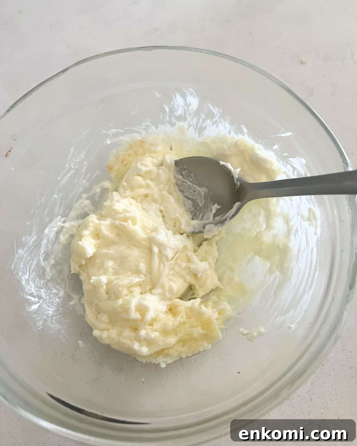 Cream cheese and mozzarella melted in a bowl.