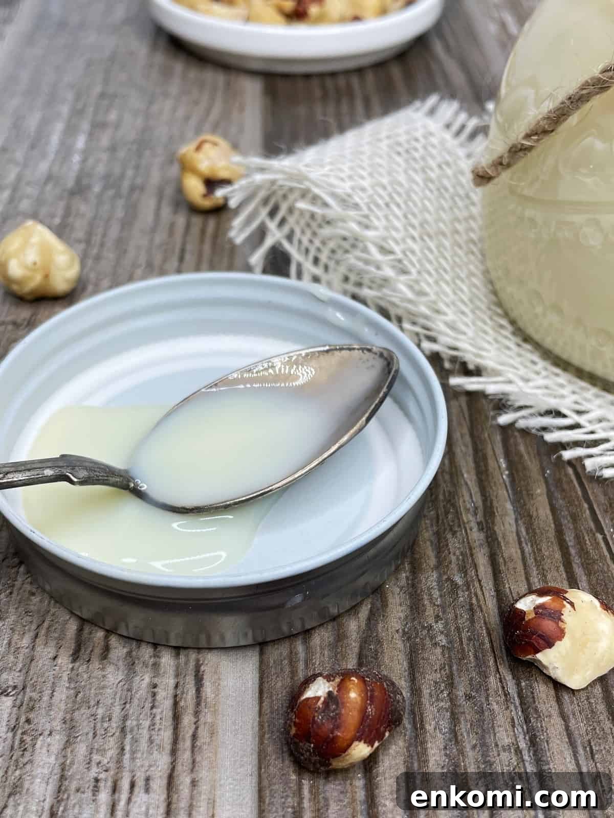 Homemade Condensed Milk Recipe for Rich, Creamy Results 6 A teaspoon with sweet condensed milk over the lid