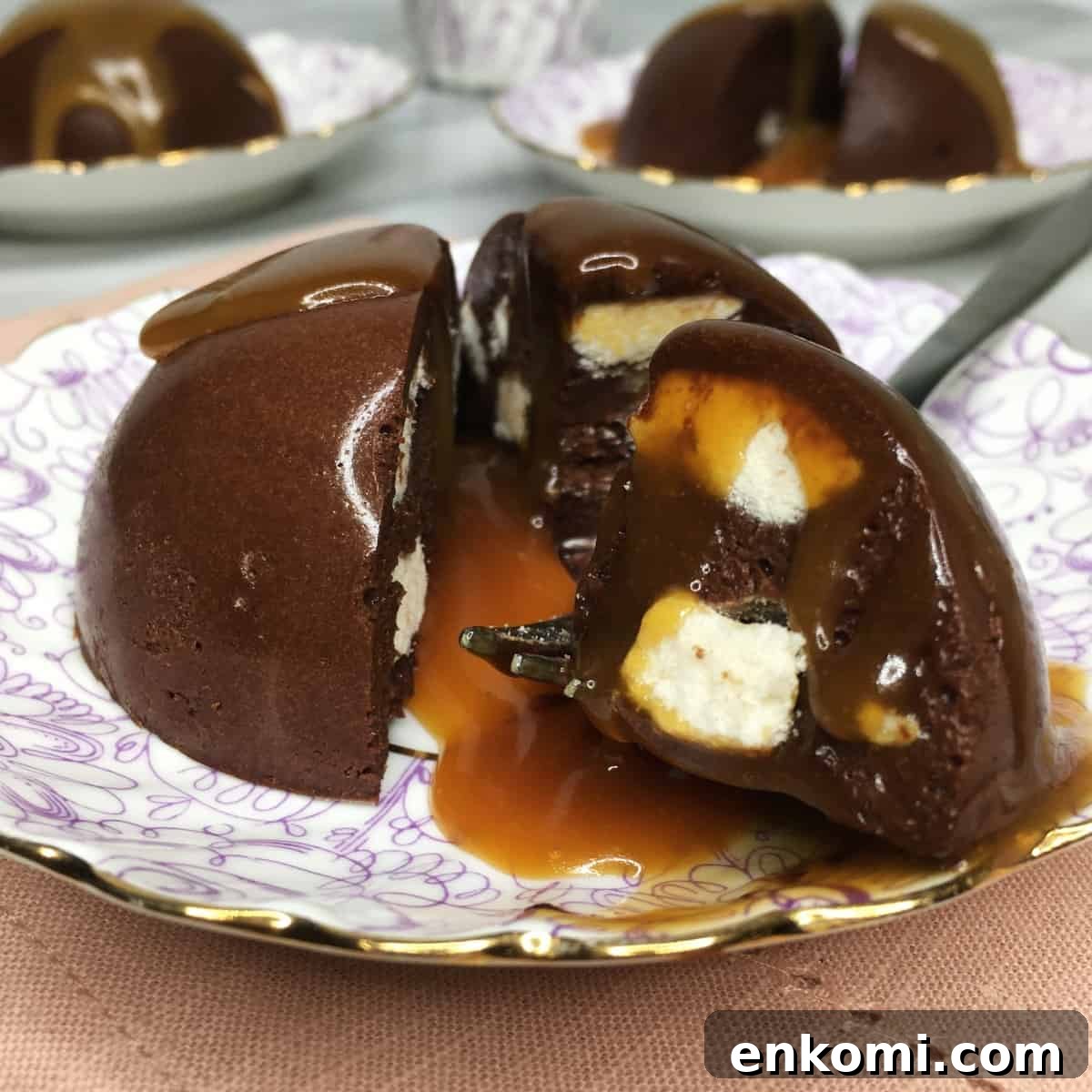 Sliced chocolate terrine shaped as a half-sphere with a fork on a dessert plate.