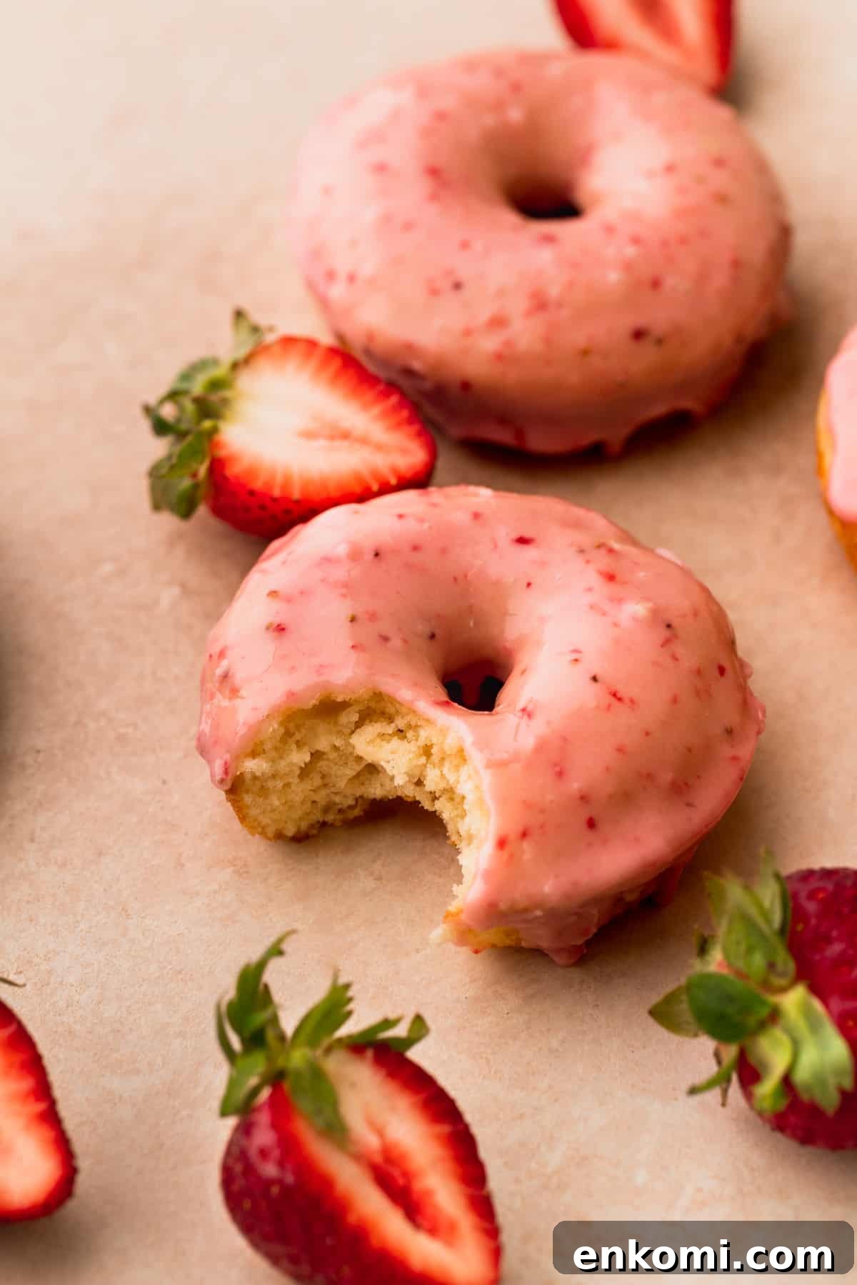 Bite missing from one donut.