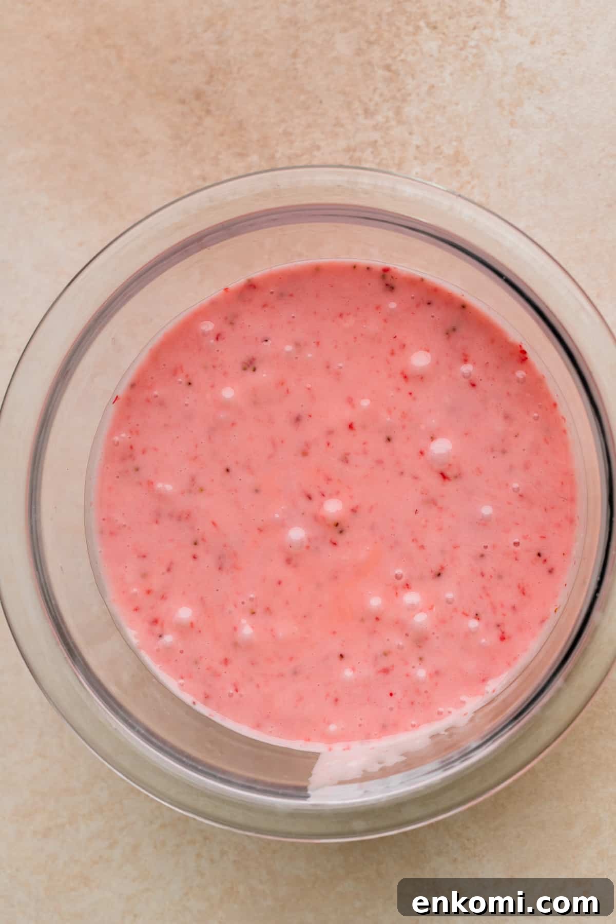 Strawberry glaze in a glass bowl.