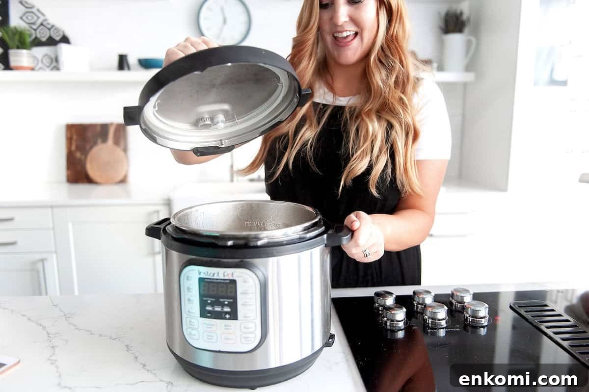 Meal Prep: How to Plan and Freeze Weekly Dinners for Busy Weeks 5 steph checking her freezer meal in the instant pot