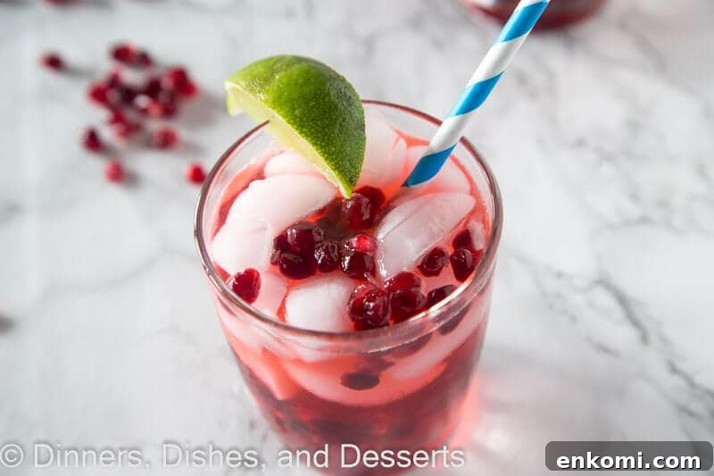 Pomegranate Vodka Gimlet Recipe: Refreshing Cocktail Guide 3 Pomegranate vodka gimlet in a cup with a straw
