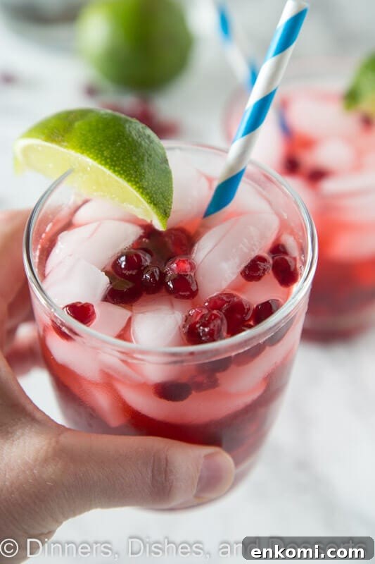 Pomegranate Vodka Gimlet Recipe: Refreshing Cocktail Guide 4 Pomegranate vodka gimlet in a cup with a straw