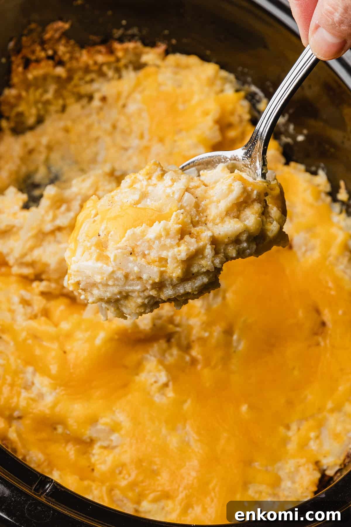 Crockpot Cheesy Hashbrown Casserole Recipe for Slow Cooker 2 The complete recipe being served out of the crockpot.