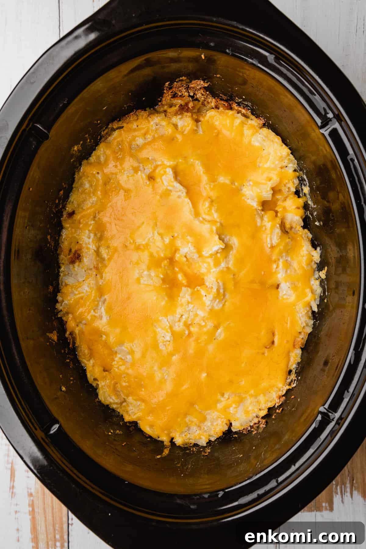 Crockpot Cheesy Hashbrown Casserole Recipe for Slow Cooker 7 The completed recipe with melted cheese on top.