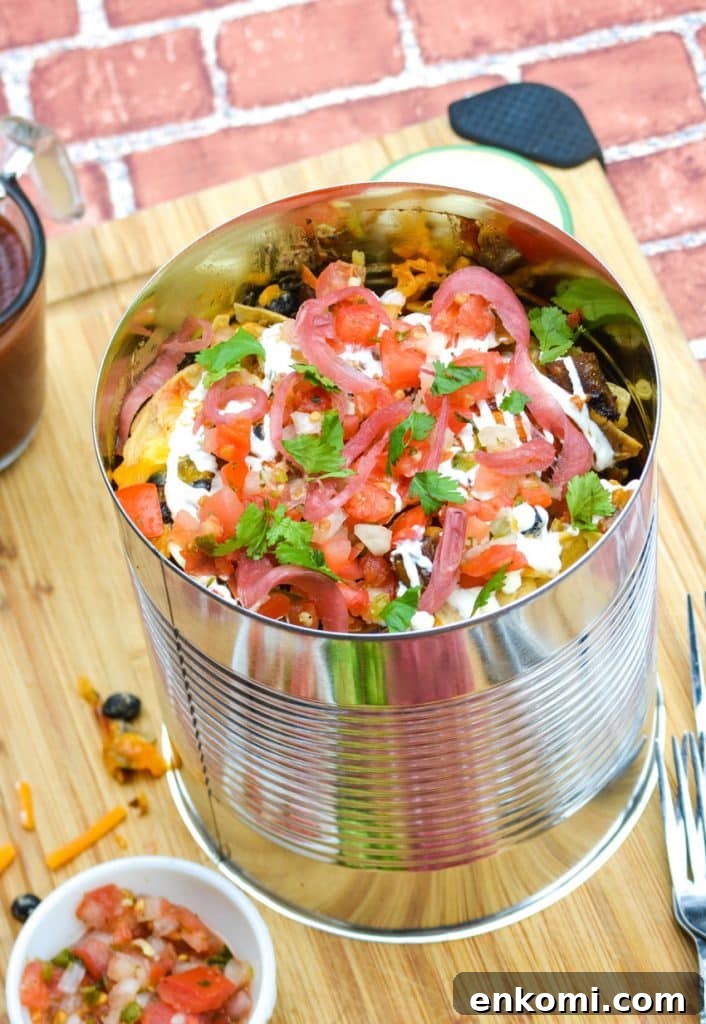Loaded Nachos: How to Make Trash Can Nachos at Home 4 copycat Guy Fieri loaded nachos in a large metal tin can