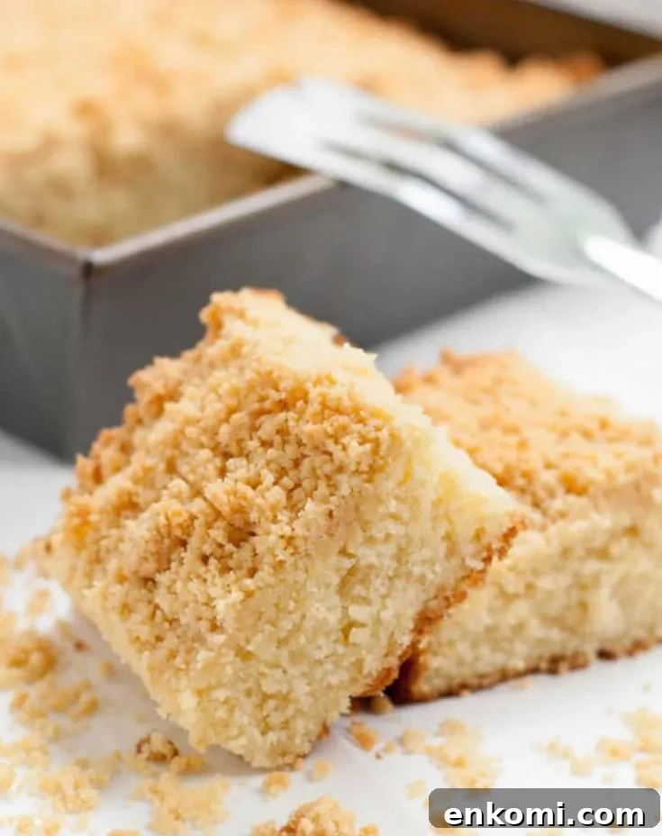 Lemon Ricotta Crumb Cake leaned against each other on parchment paper by themerchantbaker.com