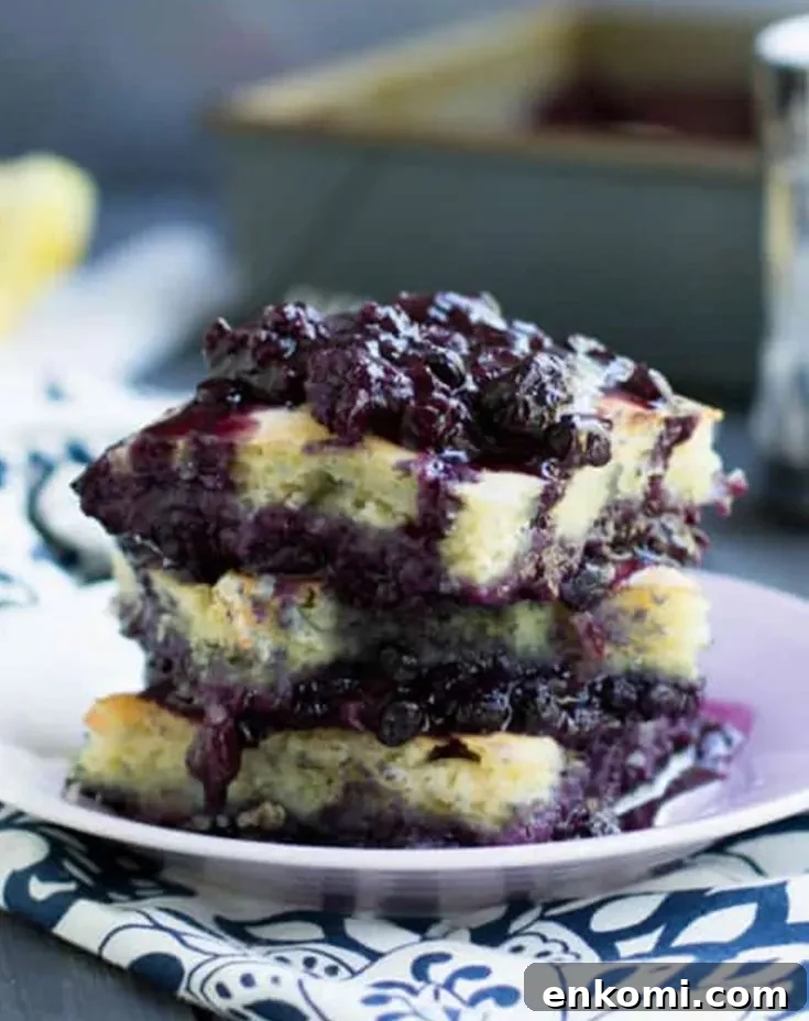 Blueberry Pancake Cobbler stacked on a white plate by themerchantbaker.com