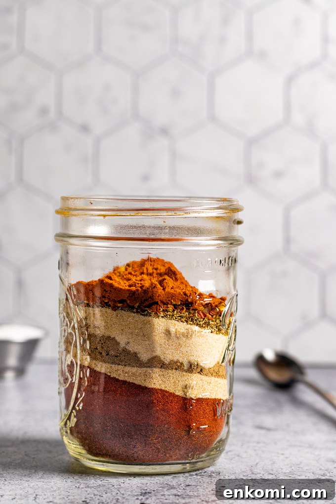 homemade fajita seasoning in layers in a mason jar.