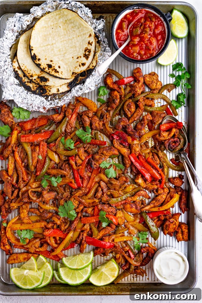 sheet pan chicken fajitas on a sheet pan.