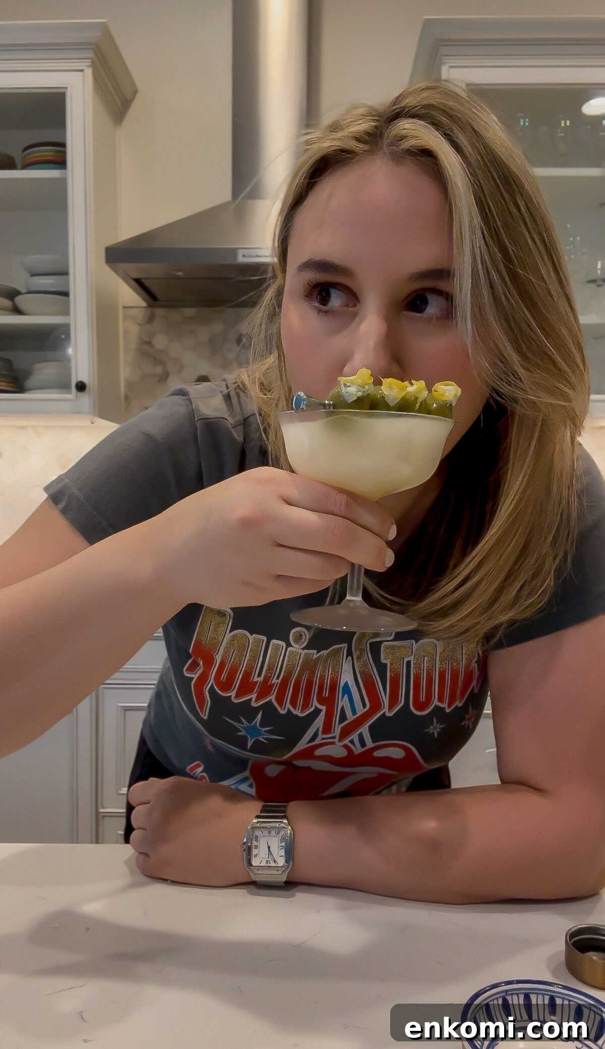 Creamy Lemon Martini with Olive Brine Twist 4 blue cheese olives sitting in the lemon martini