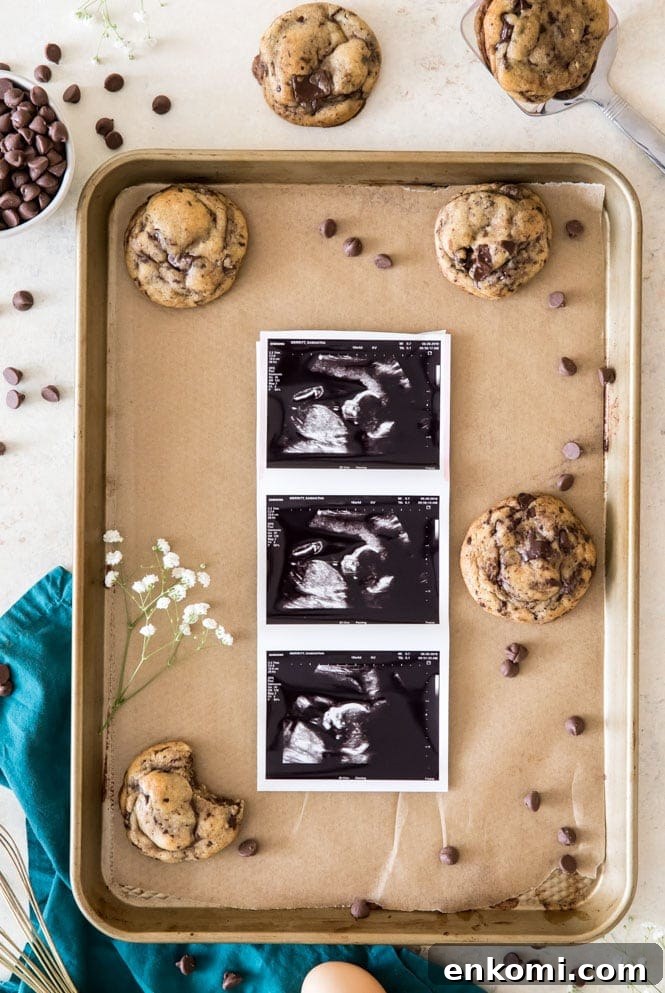 Baby scan photos on cookie sheet with cookies