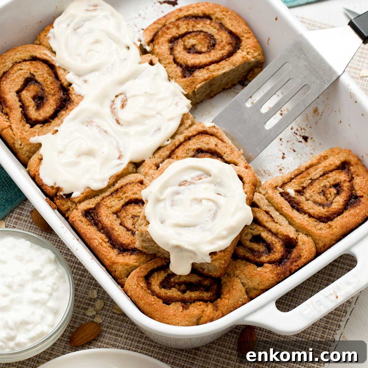 Gluten-Free Levain-Style Chocolate Chip Cookies Recipe 12 A baking dish with a batch of cottage cheese cinnamon rolls made gluten-free with oat and almond flour.