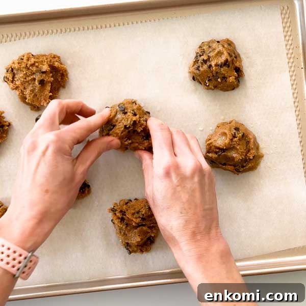 Gluten-Free Levain-Style Chocolate Chip Cookies Recipe 7 Shaping cookie dough on cookie sheet.