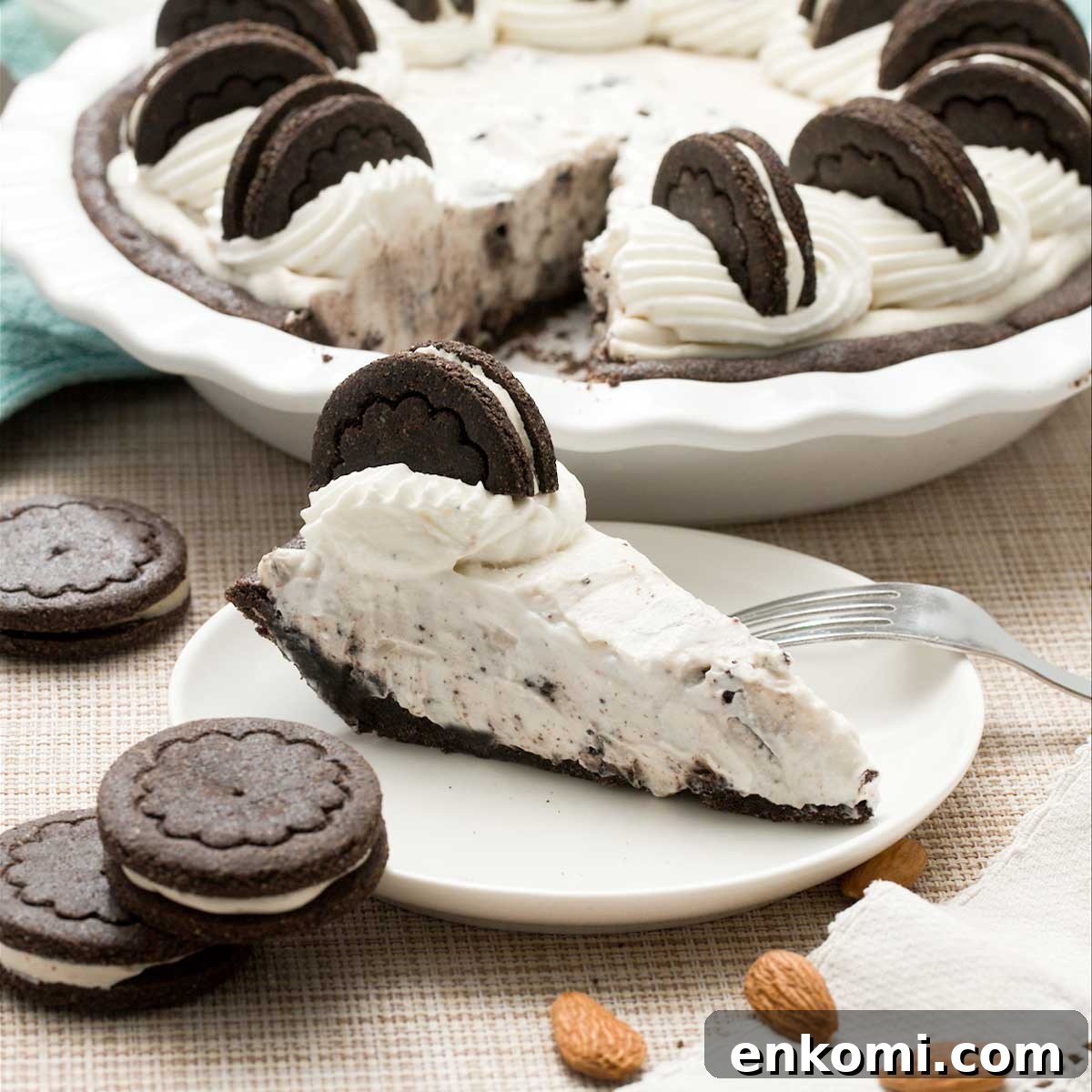 Gluten-Free Levain-Style Chocolate Chip Cookies Recipe 10 A gluten-free oreo cream pie with whipped cream on top and a slice on a plate.