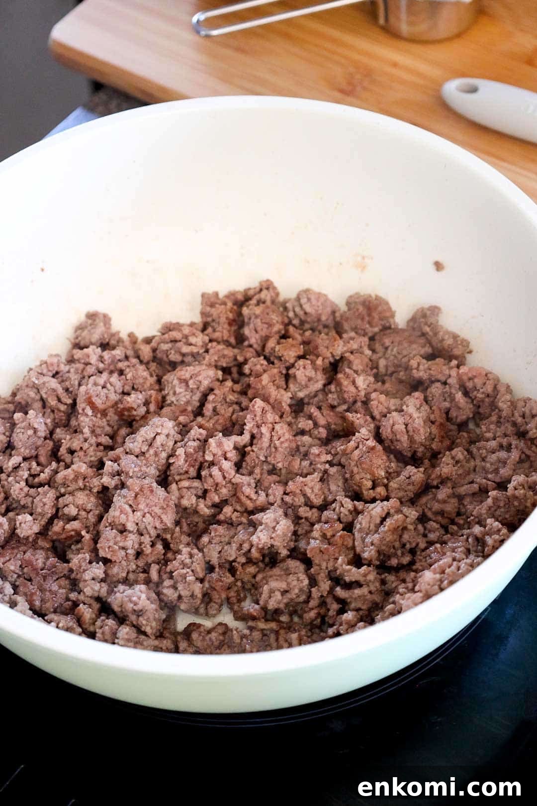 Ground beef browning in a skillet as the first step in making taco mac and cheese.