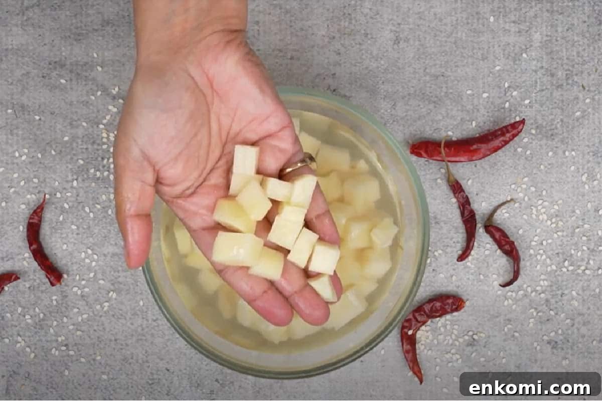 Sesame Potato Stir-Fry (Til Wale Aloo) Recipe 3 Potatoes peeled and cut into cubes.