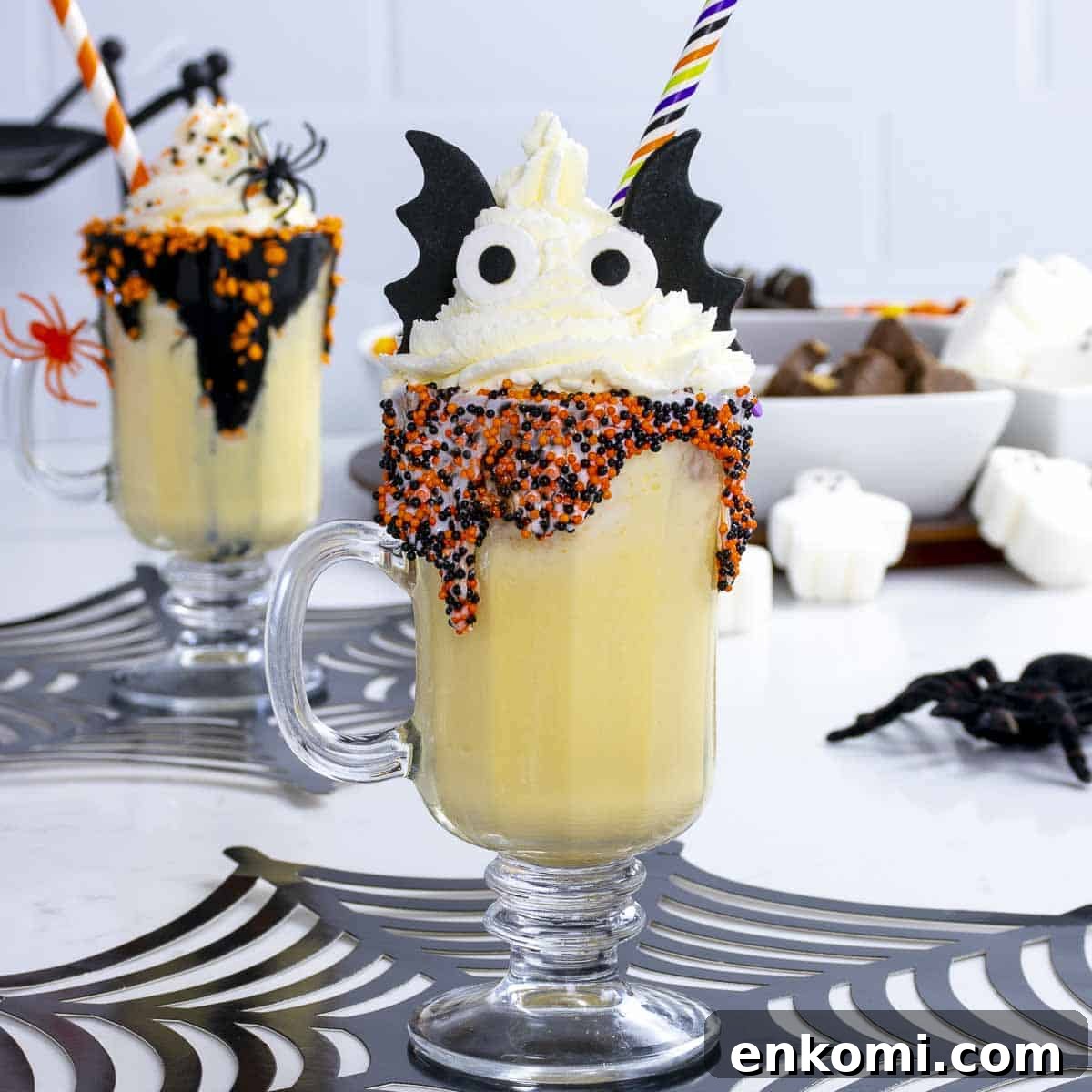 Halloween Milkshake Bar Ideas for Kids: Spooky Flavors & Toppings 5 Vanilla Halloween milkshake for kids with eyes and bat wings.