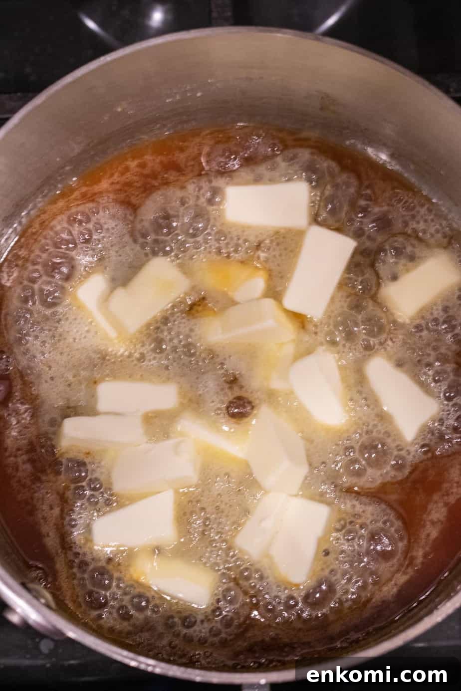 Salted Caramel Chocolate Budino Recipe for Decadent Dessert 11 cubed butter in melted sugar in saucepan