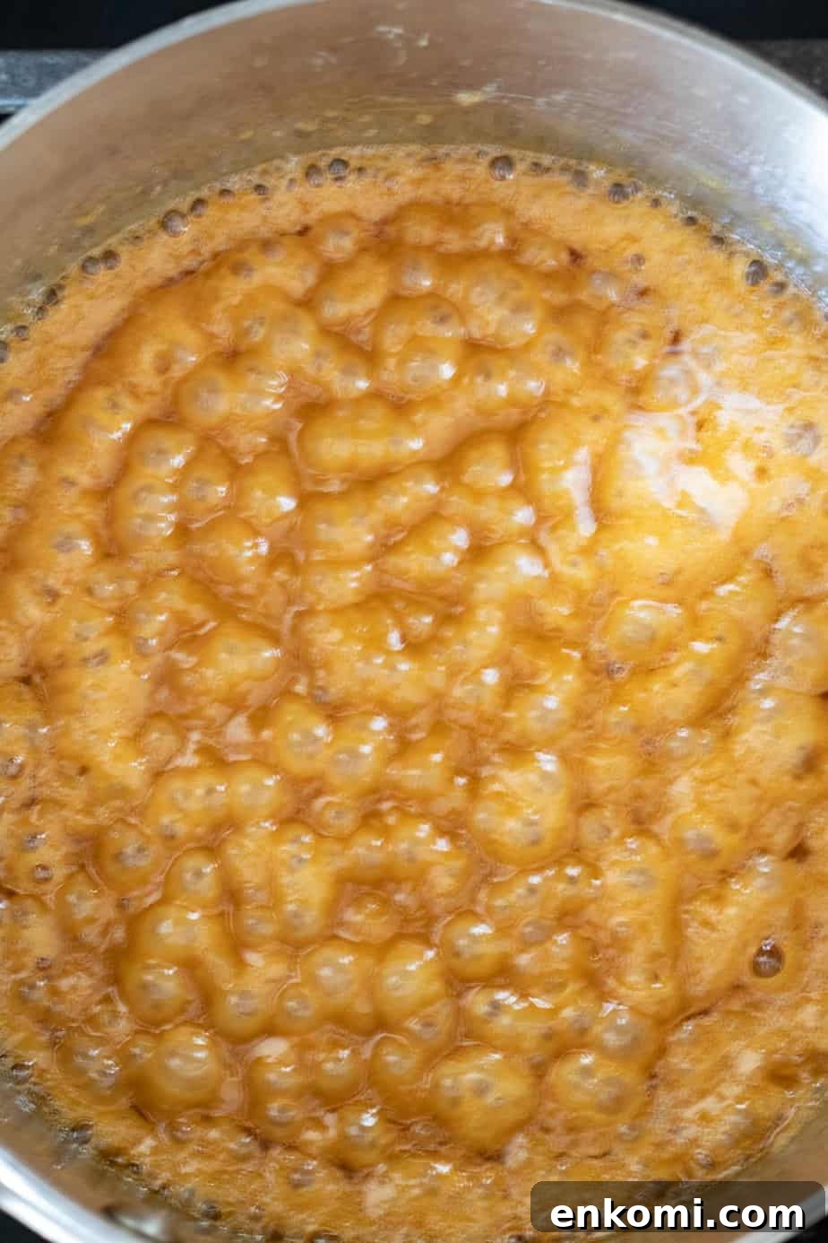 Salted Caramel Chocolate Budino Recipe for Decadent Dessert 12 making caramel in a saucepan