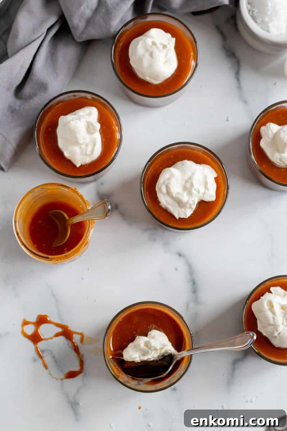 Salted Caramel Chocolate Budino Recipe for Decadent Dessert 3 overhead view of chocolate budinos with caramel and whipped cream