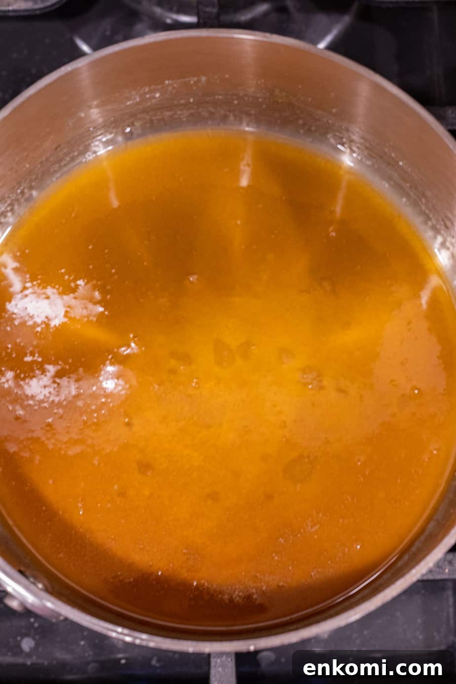 Salted Caramel Chocolate Budino Recipe for Decadent Dessert 10 golden brown melted sugar in a saucepan