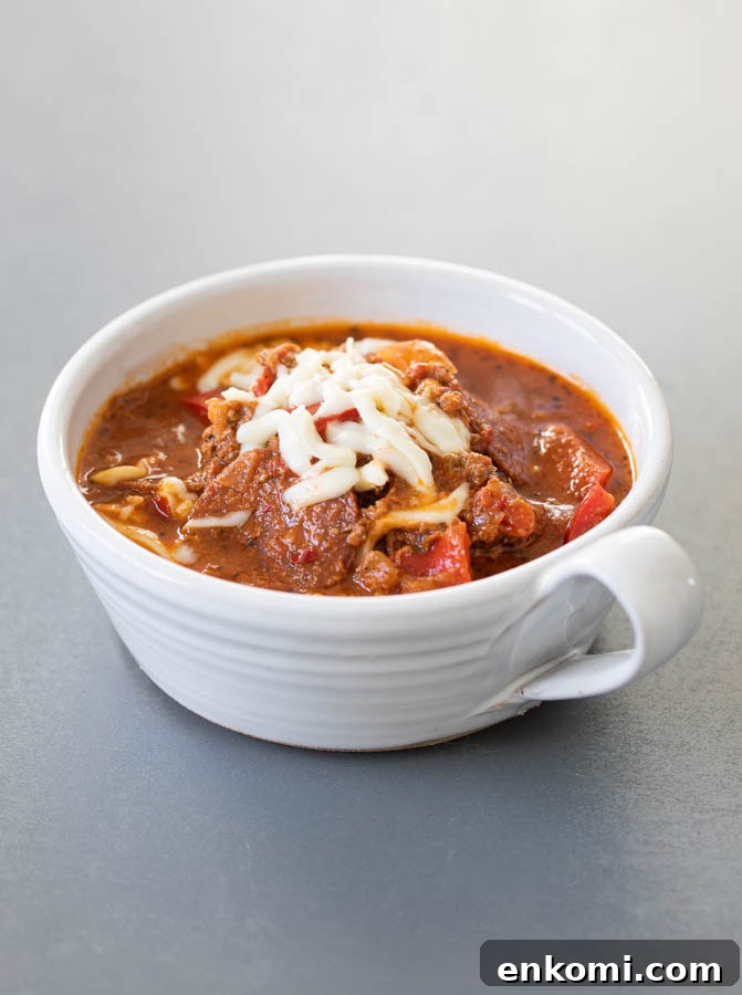 Hearty Pizza Soup Recipe: Comforting One-Pot Dinner 3 Pizza soup in a soup white soup bowl