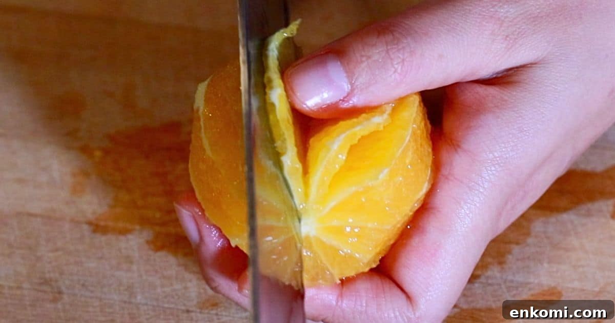 slicing oranges with a knife