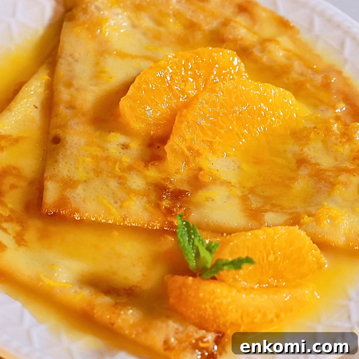 delicious crepes suzette with easy orange butter sauce on a plate