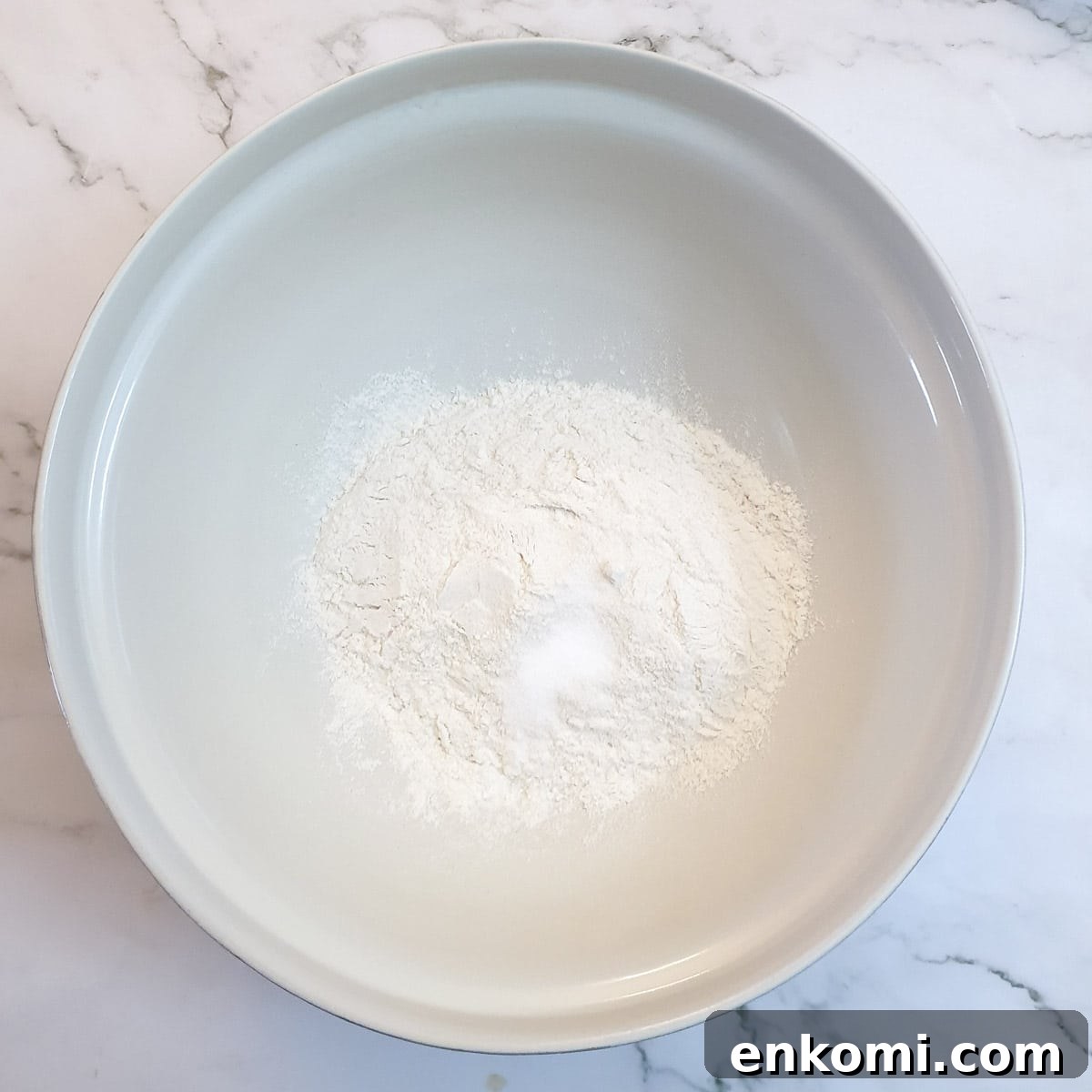 Flour and salt in a large mixing bowl.
