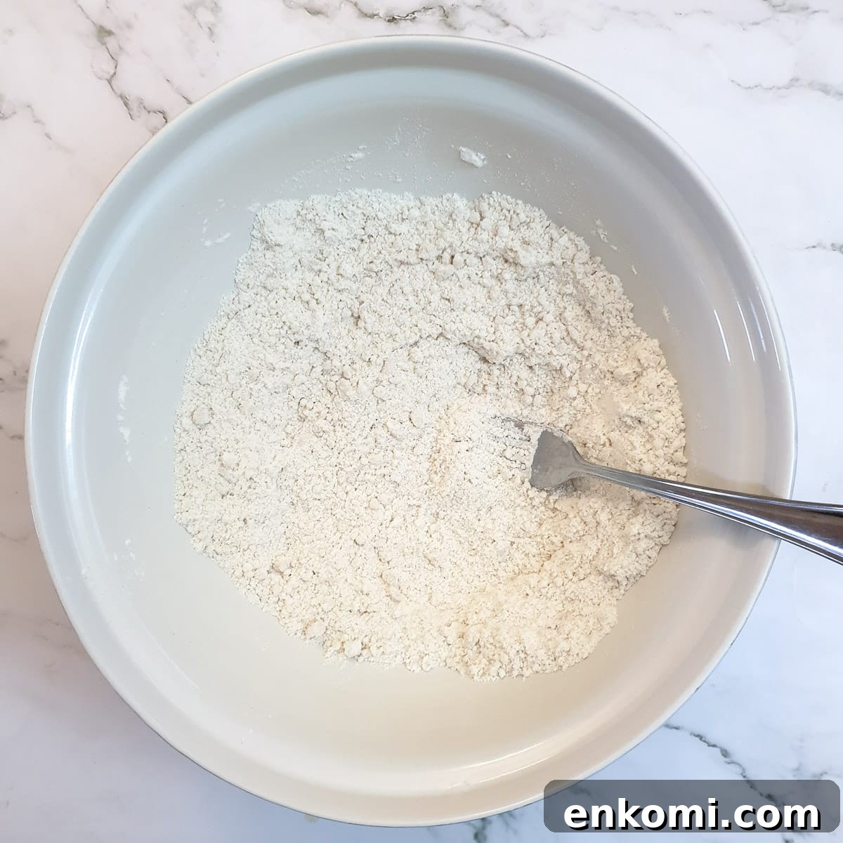Flour mixed with oil to form 'breadcrumbs'.