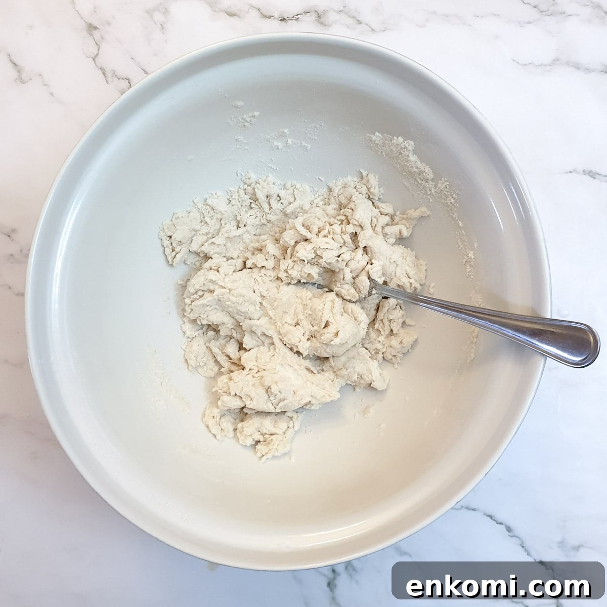 Samosa pastry mixed to a shaggy dough.